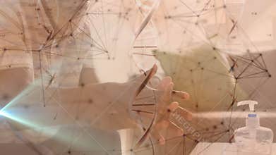 Man pressing sanitizer pump, dispensing gel and rubbing palms under health network DNA overlay