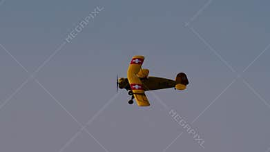 Bucker Bu 133 Jungmeister RC model in a knife-edge flight maneuver