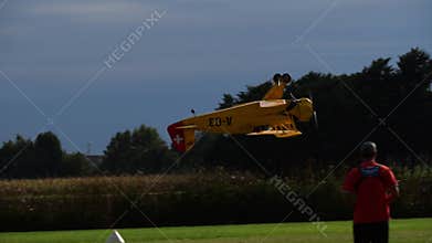 Bucker Bu 133 Jungmeister RC model performs a low altitude aerobatic sequence