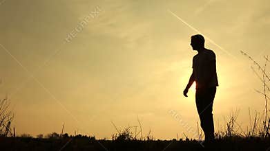 Family walk silhouetted swinging son