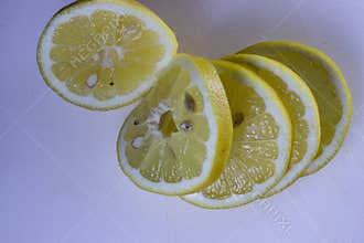 Fresh lemon slices on a white background - healthy and refreshing fruit