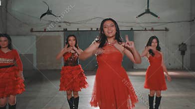 Dynamic Dance Performance in Red Dresses