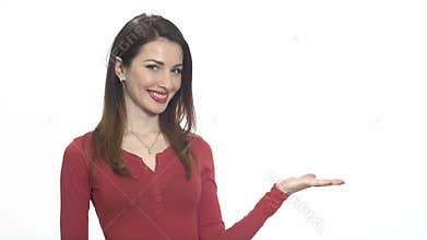 Attractive woman in red holding product with a hand isolated