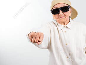 Cool grandma kicks with her fist