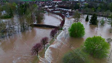 Aerial view the flooded houses and the city. The houses are flooded with dirty water of the flooded river. France