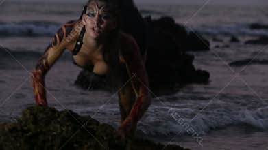 Girl Performers dance acrobatic stunts in the water