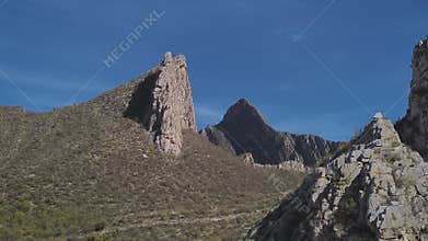 Rocky mountain peaks rotating aerial view in Huasteca region