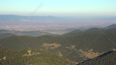 Aerial panoramic view settlements on flat plains below forested hills in Bolu Turkiye, anatolia, village, drone, gerede