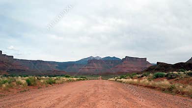 Dirt road in barren landscape of Utah