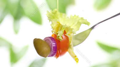 Fork salad with tomato olive oil diet concept