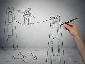 Businessman walking on a rope