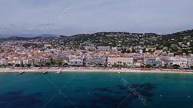Aerial pan along Boulevard de la Croisette in Cannes, Palais and Carlton