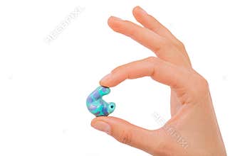 isolated on white earplug in hand. personally molded earplugs