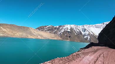 Glacial lake and snow capped Andes mountains