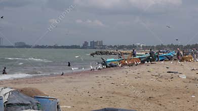 Fishermen unload their catch from old boats, editorial video
