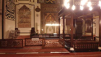 Ornate mihrab and Islamic decoration glow inside Bursa Ulu Cami at night in Turkiye, mosque, interior, ulu camii, camii