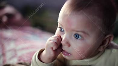 Baby Attentively watch TV. Darck backgroung, Slow motion