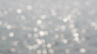 Sparkle glitter Blurry Bokeh of reflective wave in the pool