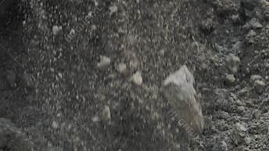 Slowmotion excavator bucket digging big pile of soil and dirt at building site