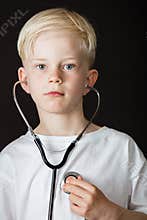 Young boy with aspirations to be a doctor