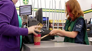 Motion of people paying credit card at check out counter