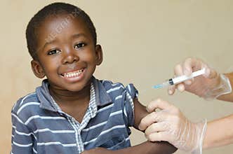 African boy happy about getting a vaccination