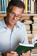 Mature man reading book