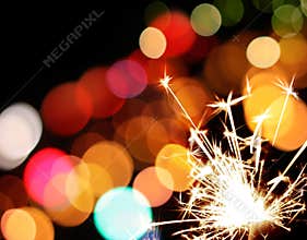 Holiday sparkler and colorful lights