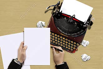 Vintage typewriter with author hand