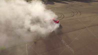 Red car burning tires