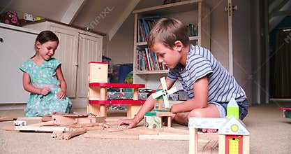 Children Playing With Toys In Bedroom