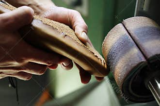 Grinding cast shoes in shoe manufacturing plant
