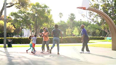 Multi Generation Family Playing Basketball In Slow Motion