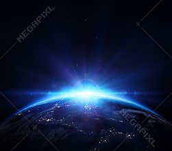Planet earth with sunrise in the space