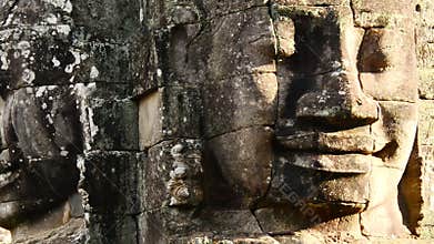 Zoom out- Stone Carving of Two Headed Buddha Goddess on Temple Wall - Angkor Wat, Cambodia