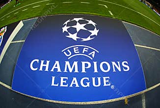 Board with UEFA Champions League Logo on the ground