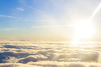 high above the sun and clouds.