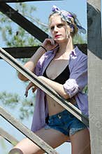 Woman in bra bikini, shirt and bandana