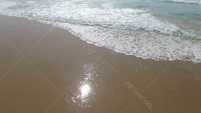 Aerial from ocean waves at Praia Vale Figueiras Portugal
