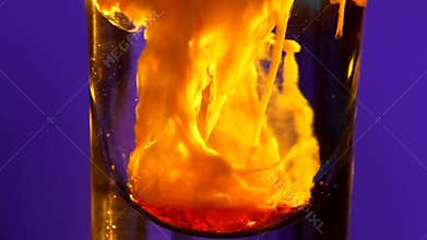 Pouring liquid alcohol into a bottom of glass