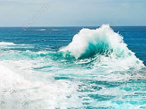 Ocean wave breaking the sea water