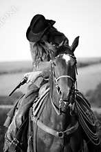 Cowboy on a horse with a gun