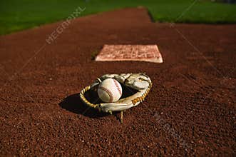 Baseball in glove on the field