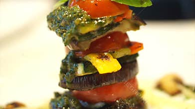Healthy vegetarian cuisine, Grill tomatoes and eggplants slice with pesto sauce