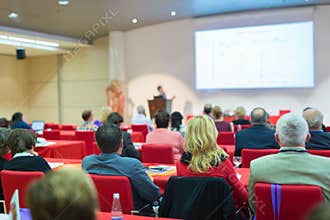 Audience in lecture hall on scientific conference.