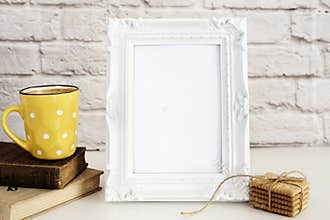 Frame Mockup. White Frame Mock Up. Yellow Cup Of Coffee With White Dots, Cappuccino, Latte, Old Books, Cookies. Display Mock-Up