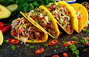 Mexican food - delicious taco shells with ground beef and home made salsa