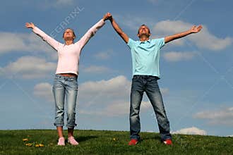 Couple Standing on Grass
