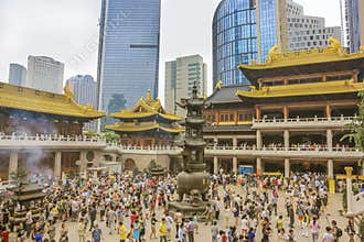 A crowd of worshipers in Buddhist temple Jing`an in Shanghai
