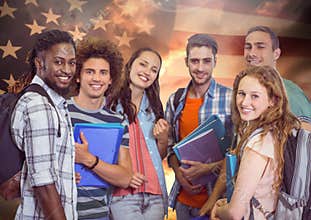 Friends standing together against american flag in background